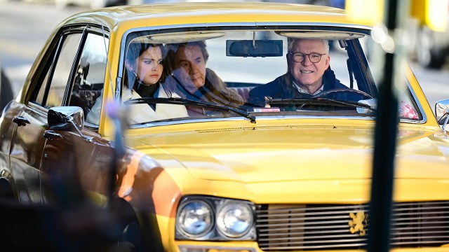 Actors Selena Gomez, Martin Short and Steve Martin are filmed on the set of Only Murders in the Building in New York City in February 2022. The TV show focuses on three strangers brought together by their love of true crime podcasts. (James Devaney/GC Images via Getty Images)