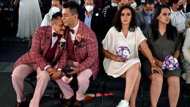 Couples wait to get married in a collective wedding held to celebrate LGBTQ Pride Month in the esplanade of the Civil Registry in Mexico City on June 24, 2022. (Alfredo Estrella/AFP via Getty Images)