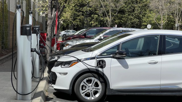 A row of electric vehicles charge at a public station in San Ramon, California, in 2023. (Smith Collection/Gado via Getty Images)