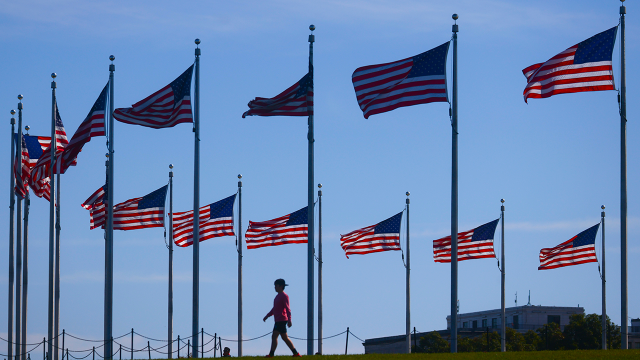 American flags fly at the Washington Monument in Washington, D.C. (Beata Zawrzel/NurPhoto via Getty Images)