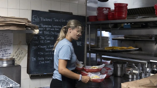 A server at Gregory's Restaurant & Bar in Somers Point, New Jersey, picks up a customer's order. (Rachel Wisniewski/The Washington Post via Getty Images)