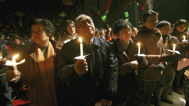 Christians pray during a Christmas service in December 2006 at St. Paul's Church, a Three-Self Patriotic Movement church in Nanjing, China. (China Photos/Getty Images)