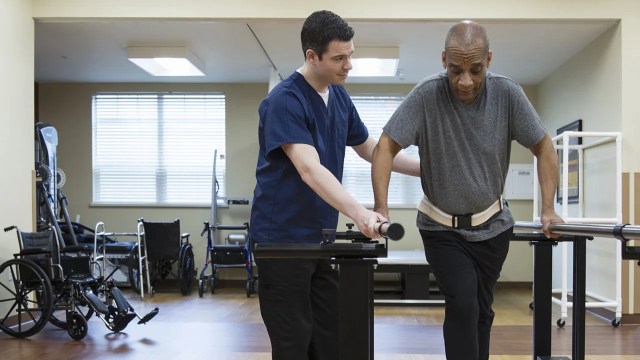 Patient having physical therapy in hospital.