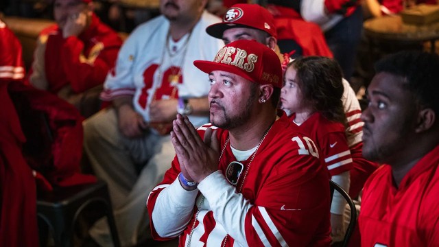 Fans watch the San Francisco 49ers play the Kansas City Chiefs during a Super Bowl LIV watch party in San Francisco on Feb. 2, 2020. The same two teams will meet in this year's Super Bowl on Feb. 11. (Philip Pacheco/Getty Images)