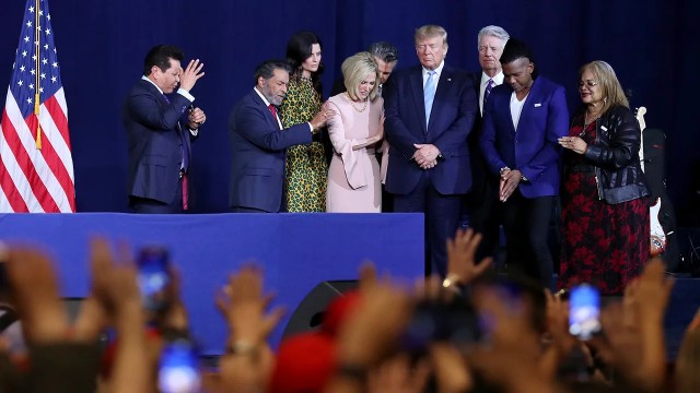 Faith leaders pray over then-President Donald Trump during an "Evangelicals for Trump" campaign event held at the King Jesus International Ministry on Jan. 3, 2020, in Miami. (Joe Raedle/Getty Images)