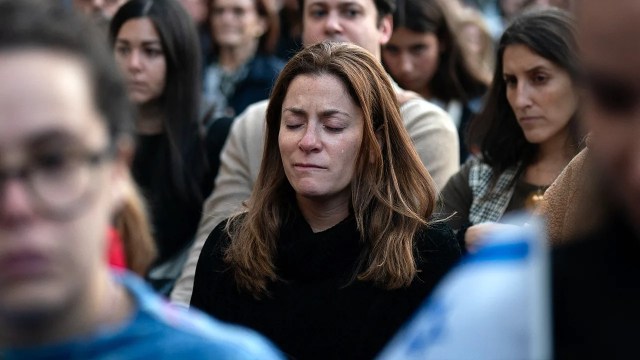 A person cries during a prayer service and candlelight vigil for Israel at Temple Emanu-El in New York City on Oct. 9, 2023. (Adam Gray/AFP via Getty Images)