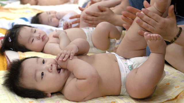 South Korean mothers take a baby massage training course at a public health center in Seoul as part of a government-organized welfare program in 2005. (Kim Jae-Hwan/AFP via Getty Images)