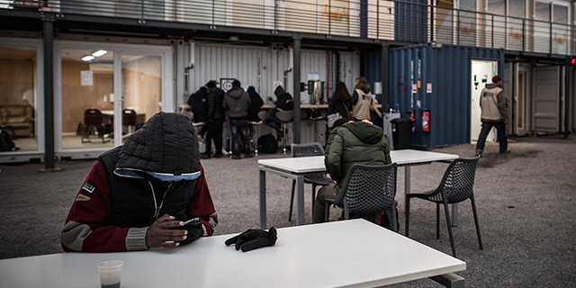 Migrants at the processing center for migrants and refugees in northern Paris in November 2016. (Philippe Lopez/AFP/Getty Images)