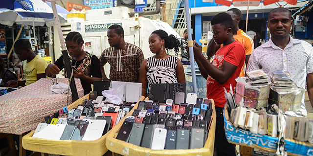 Nigerians buy and sell mobile phones, computers and other devices at a popular electronics bazaar in Ikeja, a suburb of Lagos, in 2015. (Mohammed Elshamy/Anadolu Agency/Getty Images)