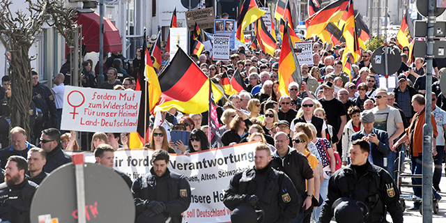 Protesters in Kandel, Germany, demonstrate over migration politics and domestic security in April. (Uli Deck/Picture Alliance via Getty Images)