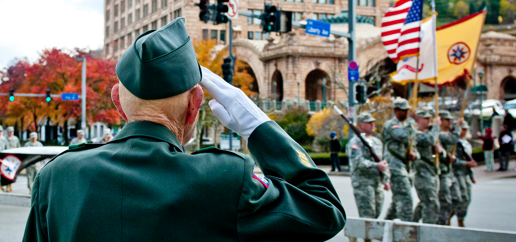 Veteran Salutes Flag During Parade