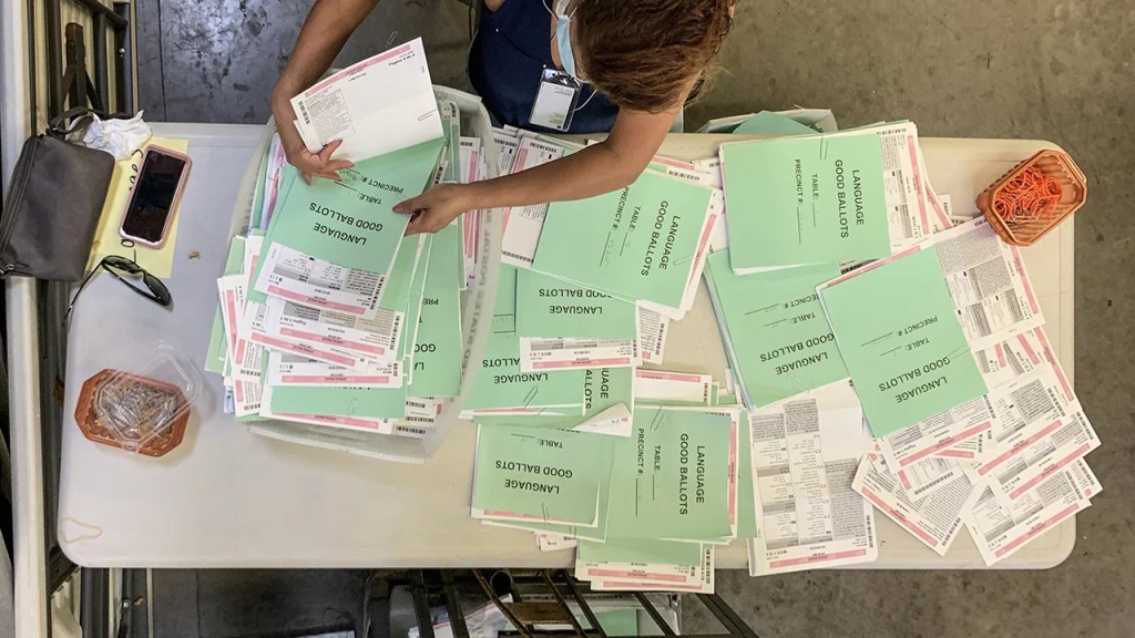 A worker processes ballots at the Orange County Registrar of Voters in Santa Ana, California, on Oct. 16, 2020. (Jeff Gritchen/MediaNews Group/Orange County Register via Getty Images)