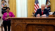 President Donald Trump signs a pardon for Alice Johnson, who was serving a life sentence on drug-related charges, on Aug. 28, 2020, in Washington. (Evan Vucci/AP)