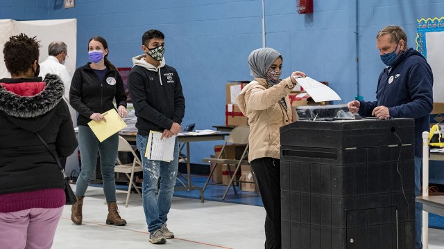 A first-time voter casts her ballot on Election Day in Manchester, New Hampshire. (Jodi Hilton/NurPhoto via Getty Images)