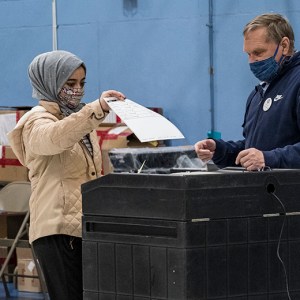 A first-time voter casts her ballot on Election Day in Manchester, New Hampshire. (Jodi Hilton/NurPhoto via Getty Images)