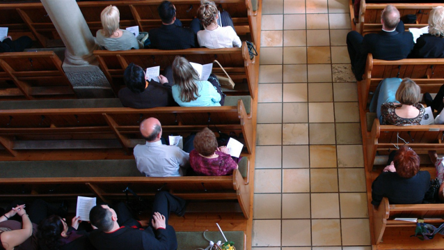 Congregation at church praying