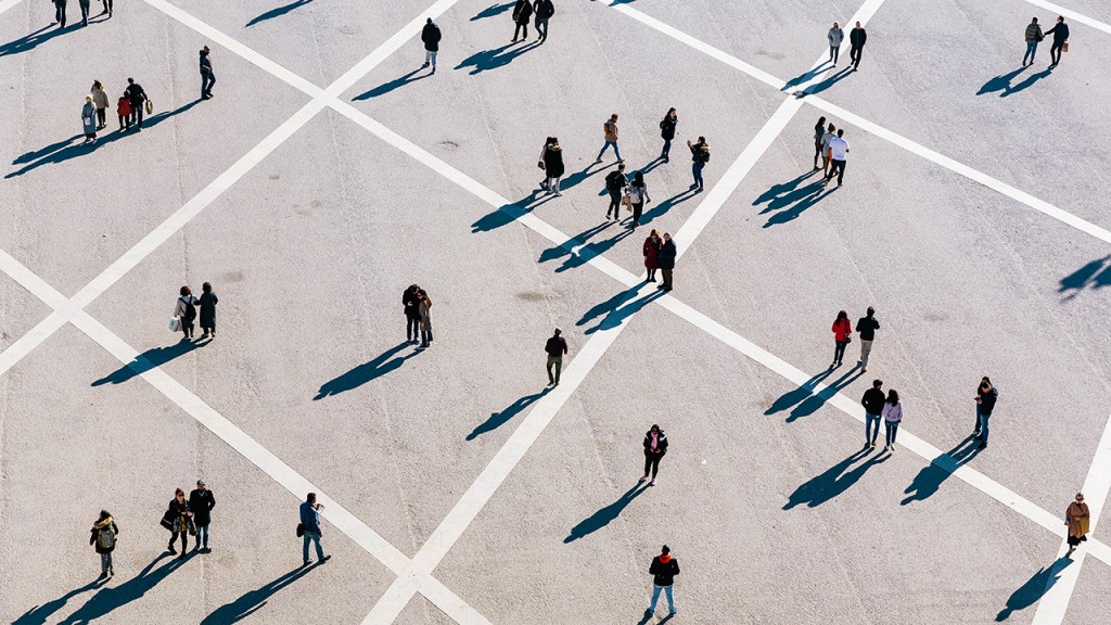 People walking at the town square on a sunny day