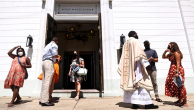 Rev. Emmanuel Mulenga (3rd R) greets parishioners after Sunday Mass at St. Augustine Catholic Church in New Orleans.