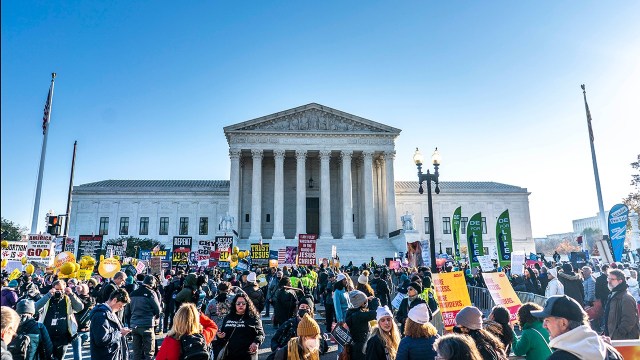 Protesters gather outside the U.S. Supreme Court on Dec. 1, 2021, as the court was hearing oral arguments over a Mississippi law restricting abortions in the state after 15 weeks of pregnancy. (Melina Mara/The Washington Post/Getty Images)