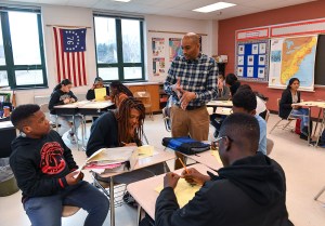History teacher Philip E. Jackson speaks to a group of his students as he teaches the history of slavery to his eighth graders at Dr.Martin Luther King, Jr., Middle School on February 27, 2019 in Germantown, Md. (Photo by Ricky Carioti/The Washington Post via Getty Images)