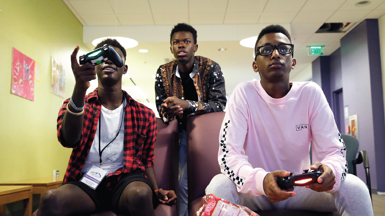 An image of teens competing in a video game tournament at the Portland Public Library in Maine in 2018. (Ben McCanna/Portland Press Herald via Getty Images)