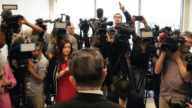 Reporters question a defense attorney at Harris County Criminal Courts at Law in Houston on March 26, 2024. (Yi-Chin Lee/Houston Chronicle via Getty Images)