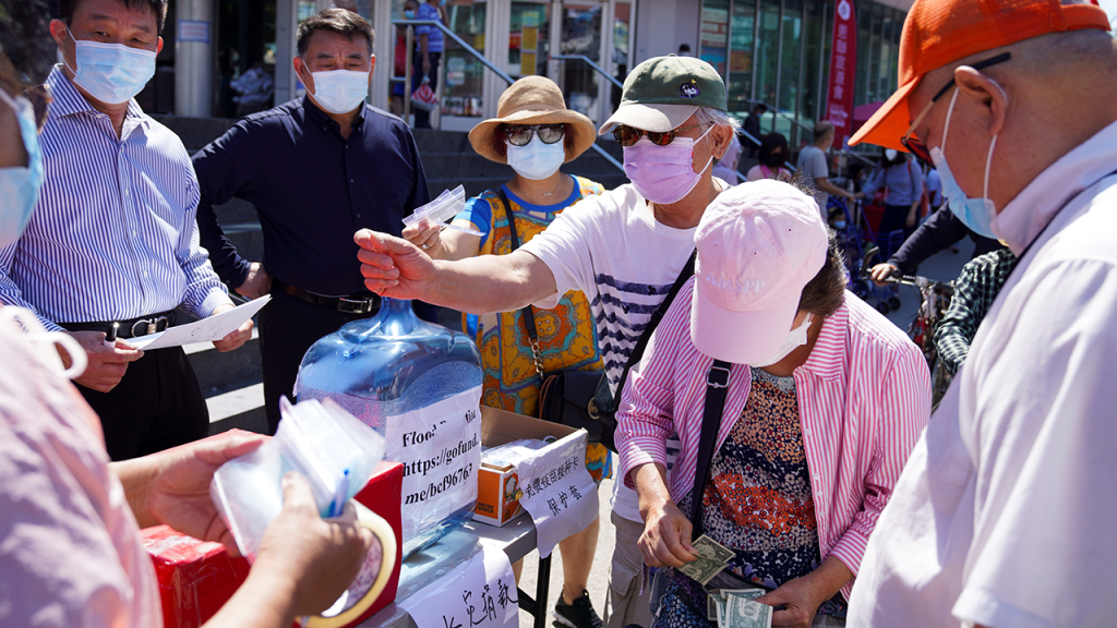 People in the Queens borough of New York City donate to help flood victims in China’s Henan Province in July 2021. (Wang Ying/Xinhua via Getty Images)