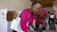 A young black girl voting on election day. Credit LPETTET via Getty Images.