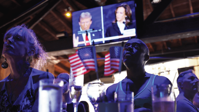 People watch the ABC News presidential debate between Vice President Kamala Harris and former President Donald Trump at a watch party in West Hollywood, California, on Sept. 10, 2024.