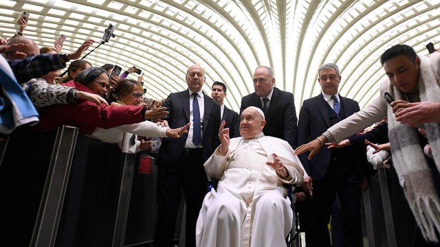 Pope Francis greets attendees of his weekly General Audience at the Paul VI Hall in Vatican City on Feb. 12, 2025, days before he was hospitalized. (Vatican Media via Vatican Pool/Getty Images)