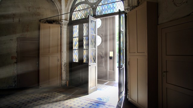 Light shines through the doors of Zionskirche, a Protestant church in Berlin.