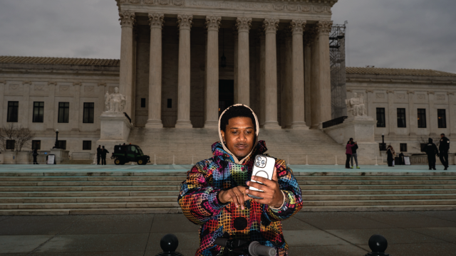 A TikTok user records a video outside the U.S. Supreme Court in Washington, D.C., on Jan. 17, 2025. (Kent Nishimura/The Washington Post via Getty Images)
