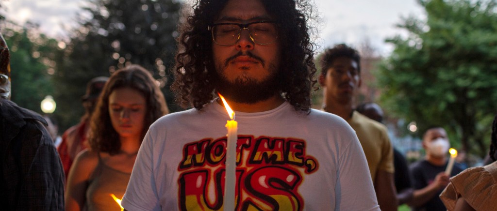 Demonstrators gather at Folger Park while joining in a
