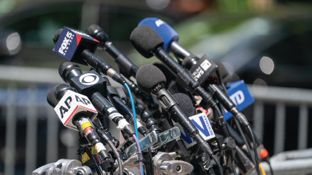 Microphones for a press conference outside New York City's Manhattan Criminal Courthouse in May 2024. (David Dee Delgado/Getty Images)