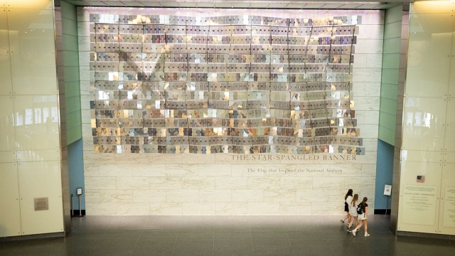 The Abstract Flag hangs above the entrance to the "Star-Spangled Banner Gallery," inside the Smithsonian National Museum of American History. (Maansi Srivastava/The Washington Post via Getty Images)
