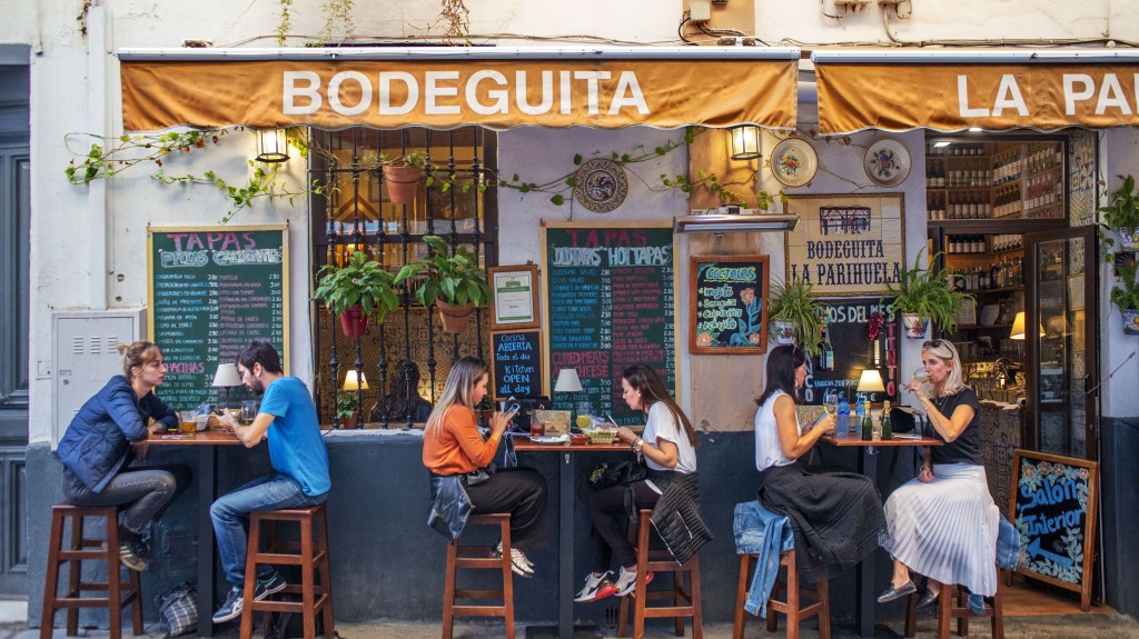 Locals enjoying food in Bodeguita La Parihuela tapas bar