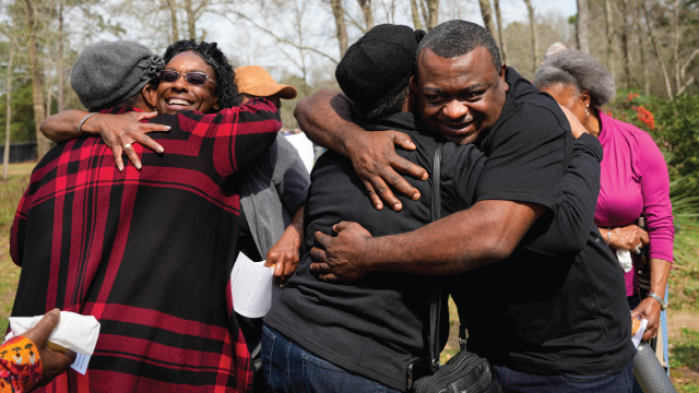 An image of Relatives meeting at Conroe Community Cemetery in Conroe, Texas, where many of the town's earliest Black residents are buried, in February 2025. (By Yi-Chin Lee/Houston Chronicle via Getty Images)