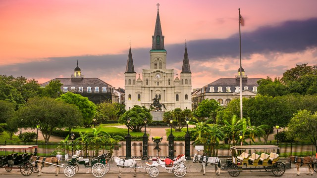 Horse-drawn carriages wait in front of the St. Louis Cathedral in New Orleans. (SeanPavonePhoto via Getty Images)