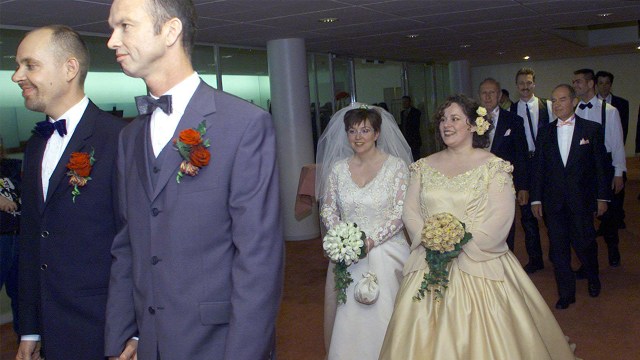 Four gay couples arrive to be married in Amsterdam City Hall on April 1, 2001, the first day same-sex couples could get legally married in the Netherlands. (Photo by Marcel Antonisse/ANPAFP via Getty Images)