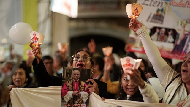 People participate in a vigil in front of the Cathedral of Saint Mary in Chiclayo, Peru, on May 18, 2025, before a Mass celebrating the beginning of Pope Leo XIV's pontificate. Leo was bishop of Chiclayo from 2015 to 2023. (Diego Torres/AFP via Getty Images)