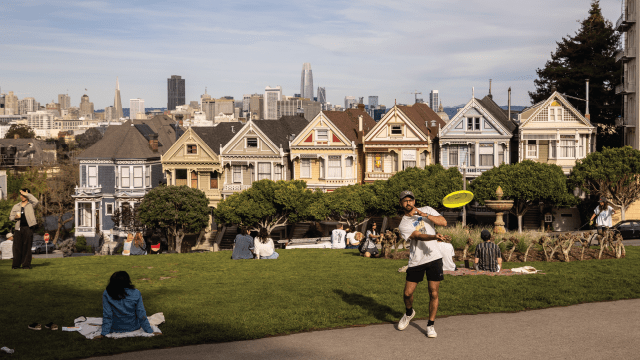 Visitors at Alamo Square Park, across from San Francisco's iconic "Painted Ladies" homes. (Stephen Lam/San Francisco Chronicle via Getty Images)