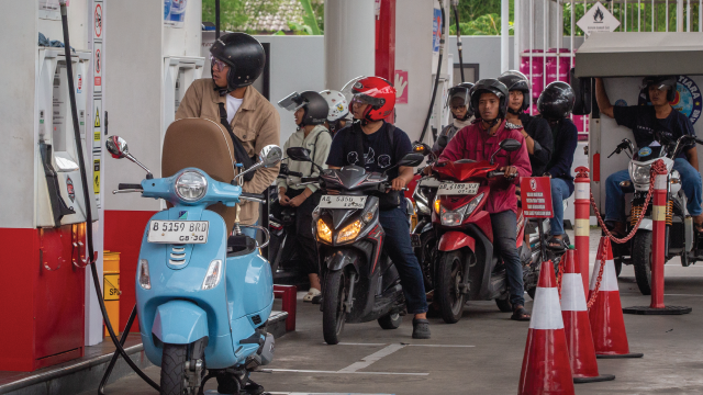 Motorcyclists line up to refuel at a gas station in Yogyakarta, Indonesia, on March 28, 2026. (Devi Rahman/AFP via Getty Images)