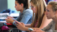Melrose High School students use their smartphones for an in-class activity. (John Tlumacki/The Boston Globe via Getty Images)