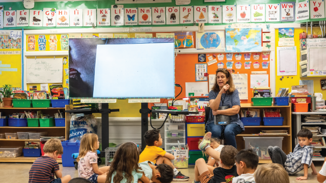 A kindergarten teacher at Ridgetop Elementary School in Austin, Texas, instructs students in Spanish. (Mikala Compton/The Austin American-Statesman via Getty Images)