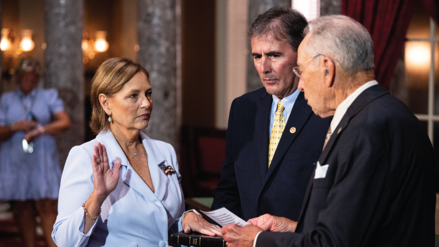 Darline Graham, accompanied by her husband, Larry Nordone, is sworn in as U.S. senator by Senate President Pro Tempore Chuck Grassley of Iowa on July 14. Graham was appointed by South Carolina Gov. Henry McMaster following the death of her brother, Sen. Lindsey Graham. (Bill Clark/CQ-Roll Call, Inc via Getty Images)