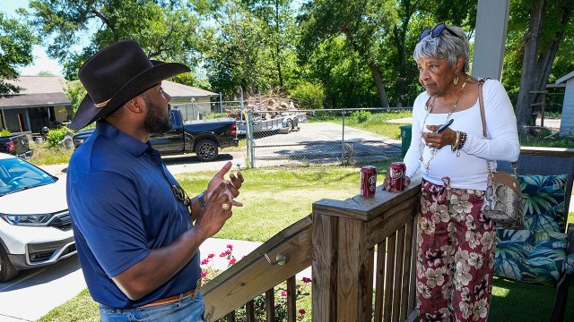 Photo showing two Houston residents talking about new flood maps in Harris County, Texas, on April 7, 2026. (Brett Coomer/Houston Chronicle via Getty Images)