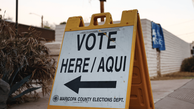 An image of a Vote Here/Aqui sign is posted at a polling place at a church after the polls opened before sunrise on November 05, 2024 in Tempe, Arizona. (Mario Tama/Getty Images)