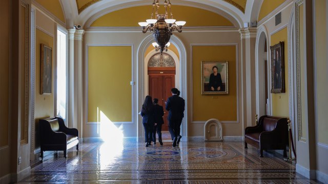 U.S. Senate pages walk through the Capitol building in Washington on Oct. 1. Congress is in recess until after the midterm elections. (Anna Moneymaker/Getty Images)
