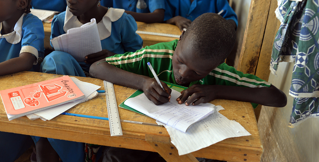 Nigerian refugee children attend classes in a UN Refugee Agency camp in Cameroon, one of several sub-Saharan Africa countries that have large attainment gaps between Muslims and Christians. (Reinnier Kaze/AFP/Getty Images)